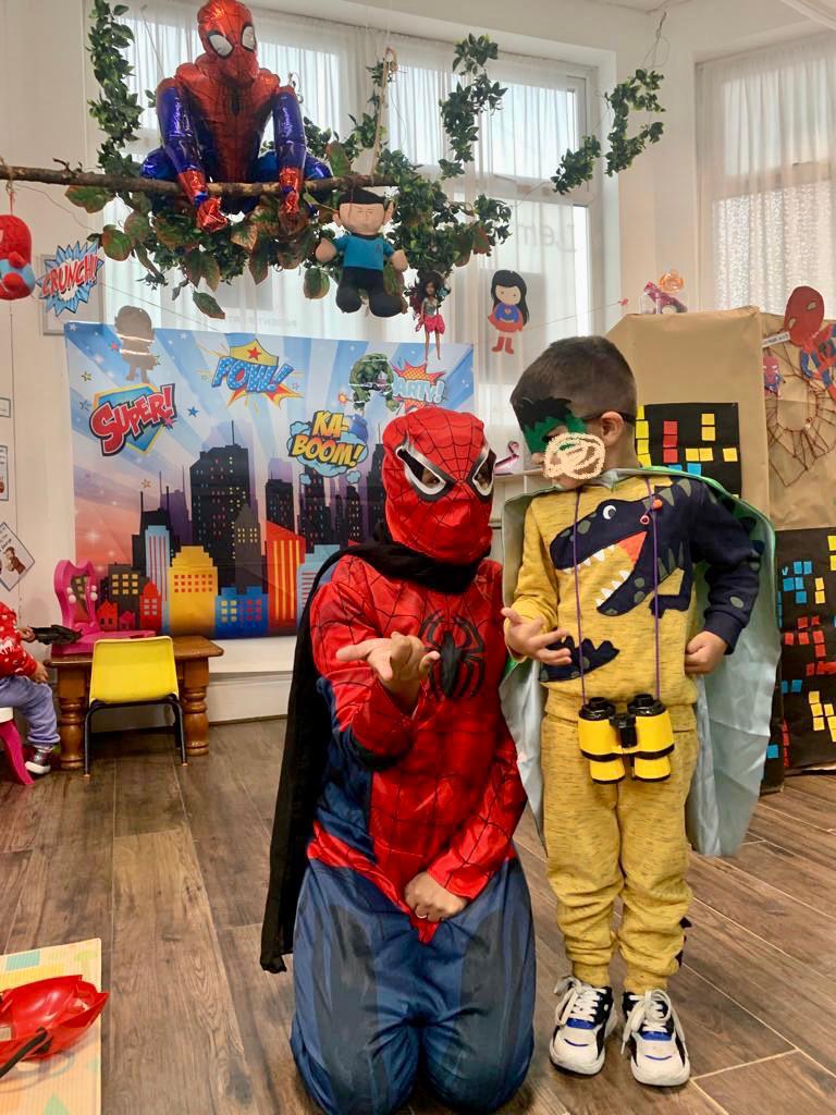 A person in spiderman costume is palying acitivity